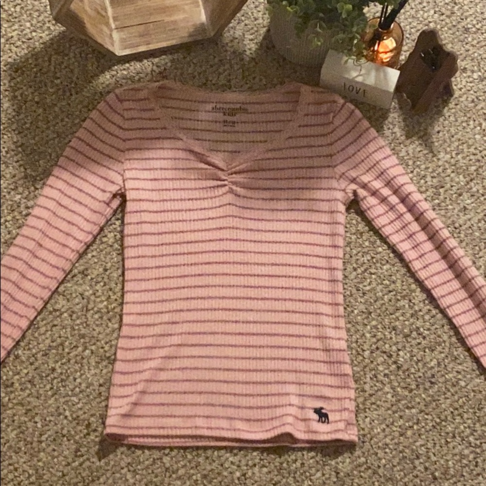 A long sleeved pink striped Abercrombie shirt